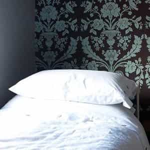 Gorgeous wallpaper and crisp white linen
